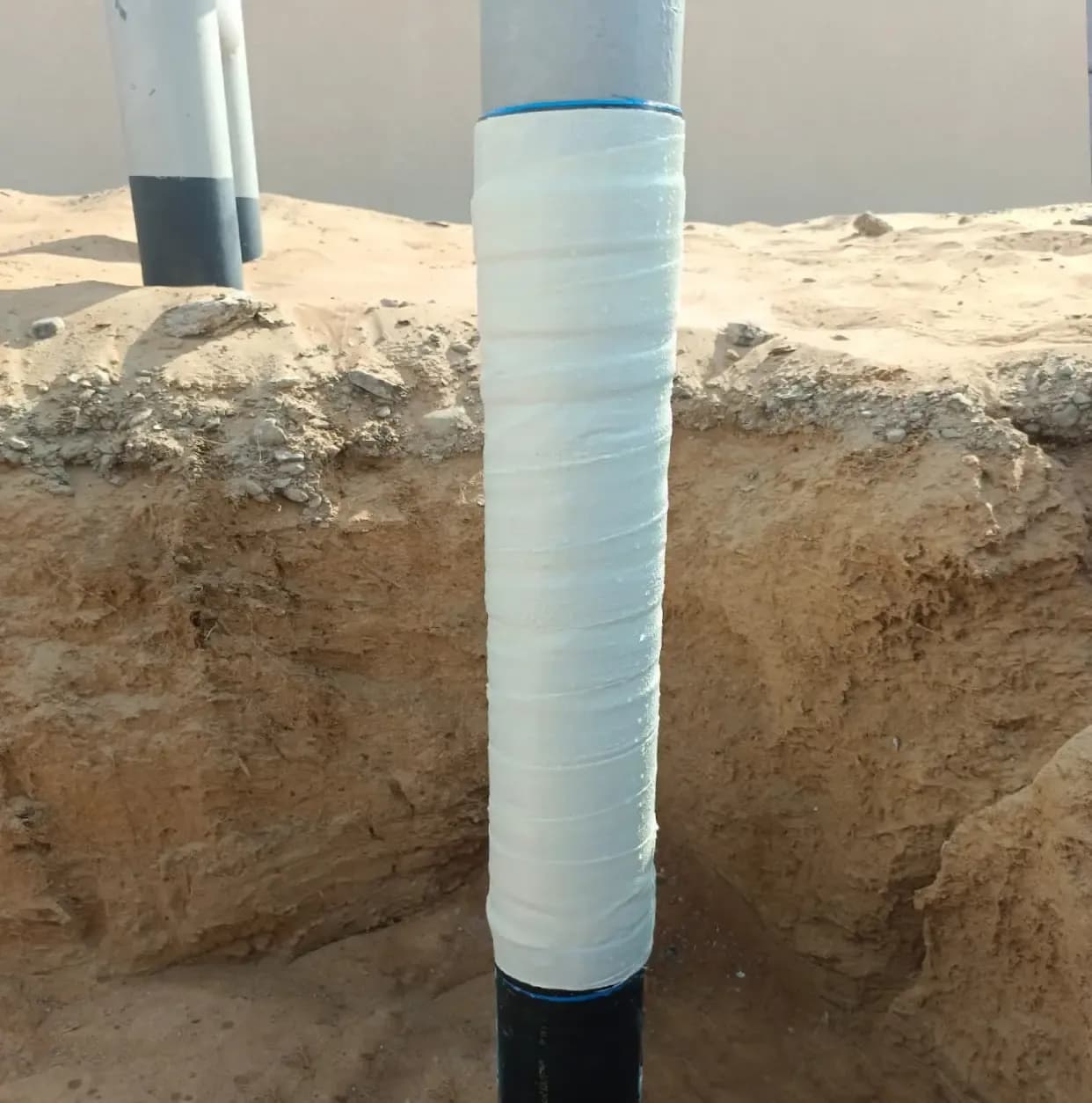 Viscotaq Viscous Elastic Wrapping (Viscopaste, Viscowrap HT, PVC & PU composite wrap) on Soil to Air Riser